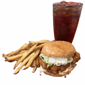 A crispy chicken sandwich with fries and a cold drink.