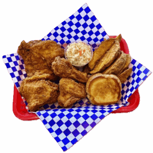 A basket of fried chicken with sides on blue checkered paper.