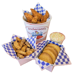 A seafood feast with fried fish, hush puppies, fried clams, and coleslaw in a bucket and baskets.
