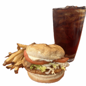 A classic fast food meal with a chicken sandwich, fries, and a soda.