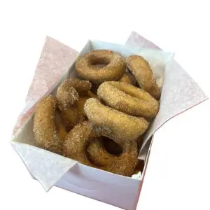 Box of sugar-coated cinnamon donuts.