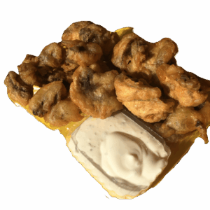 Walnuts and creamy white yogurt on a plate.